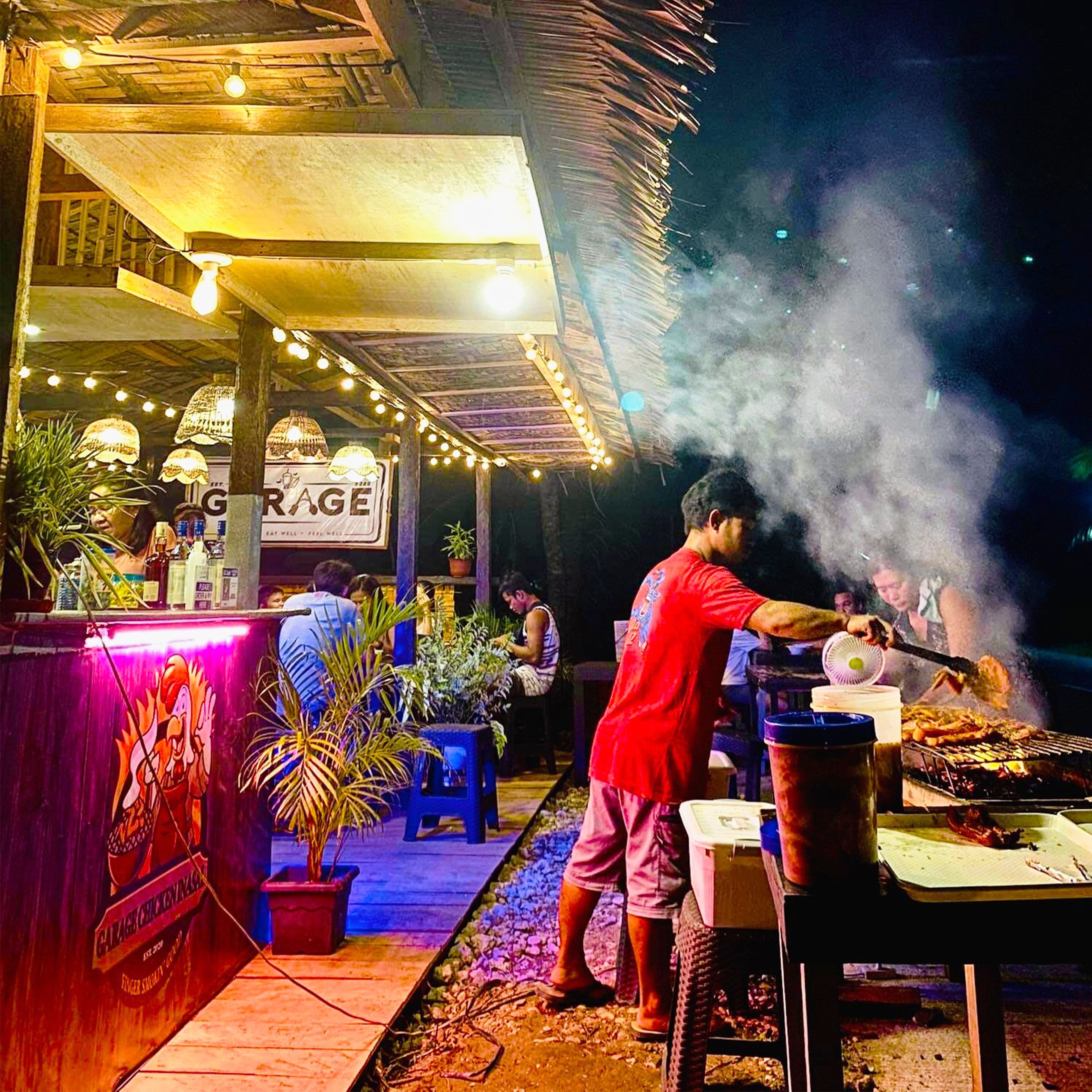 <b class="font-bara"><i class="bi bi-geo-fill h4"></i> GARAGE - OTEIZA</b> <br/>Located at P-5 Diversion Road, Brgy. Oteiza, San Agustin, Surigao del Sur. You can order your favorite snacks and barbecue chicken inasal here at Garage Oteiza.
